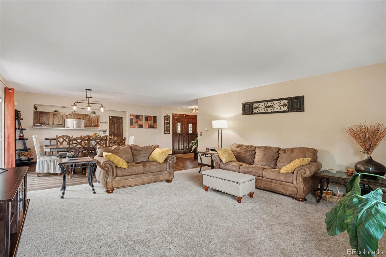 6224 Powell Road Parker, CO 80134 - Photo 3 of 40 a living room with furniture and a table