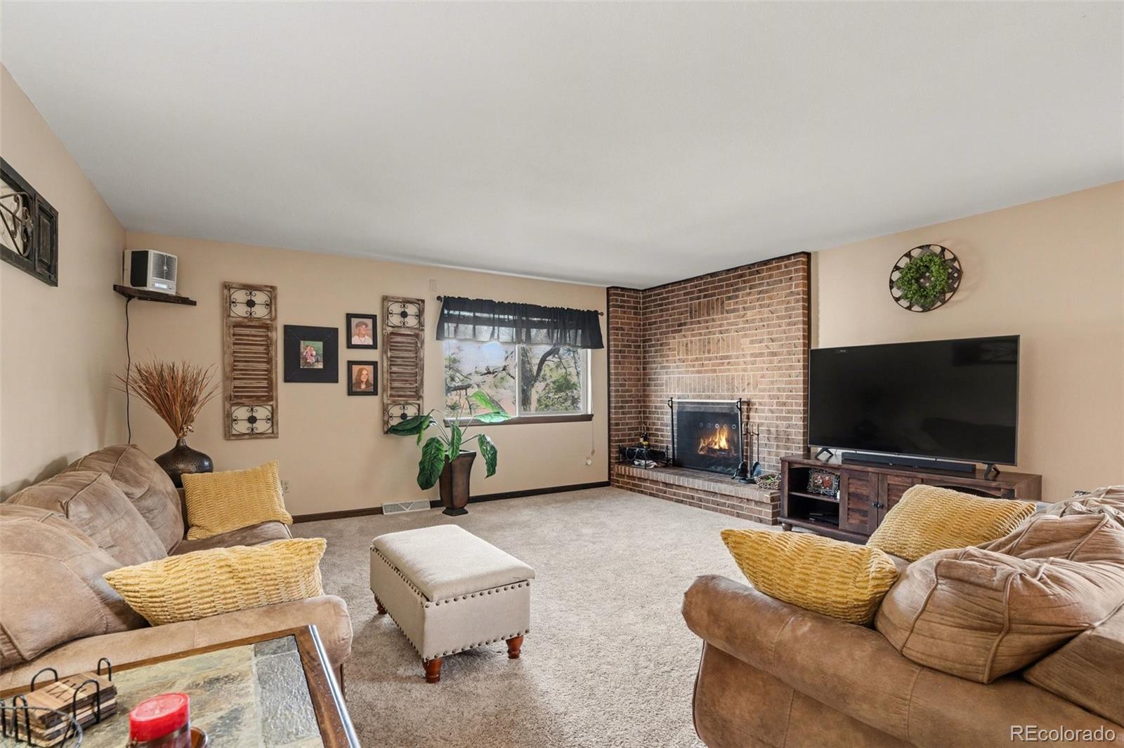 6224 Powell Road Parker, CO 80134 - Photo 4 of 40 a living room with furniture and a flat screen tv
