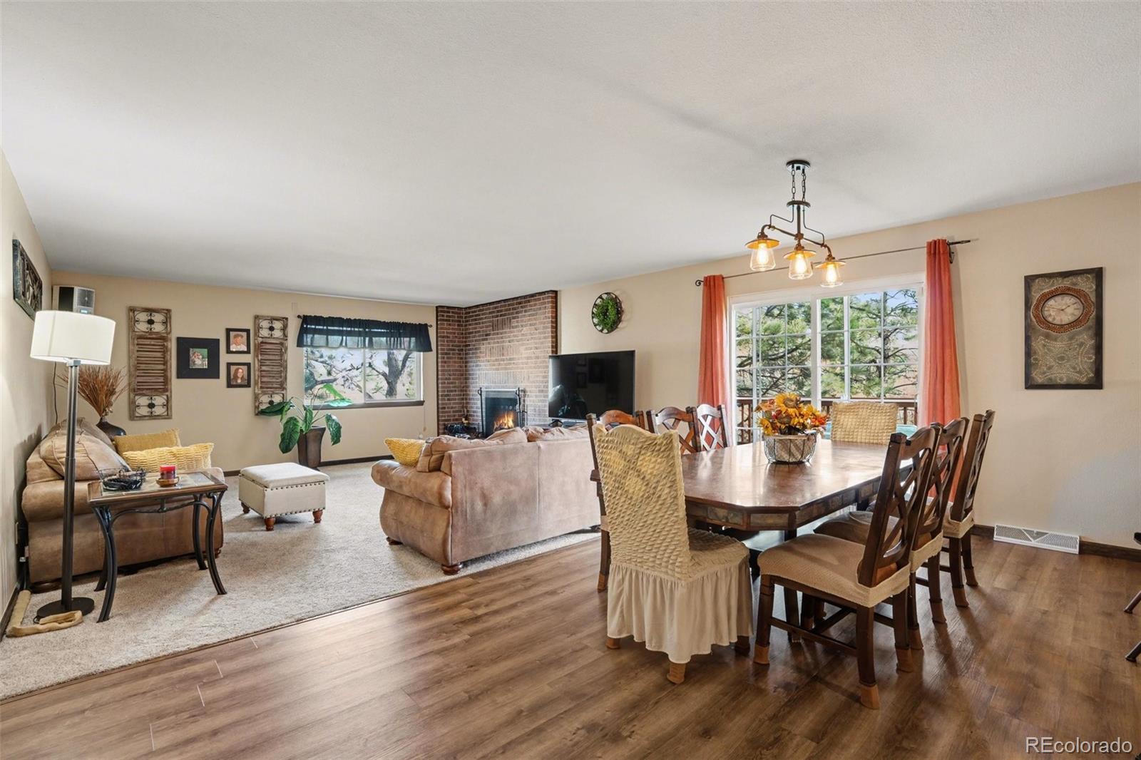 6224 Powell Road Parker, CO 80134 - Photo 6 of 40 a view of a dining room with furniture window and wooden floor