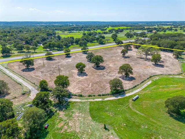 a view of a lake with houses in the back