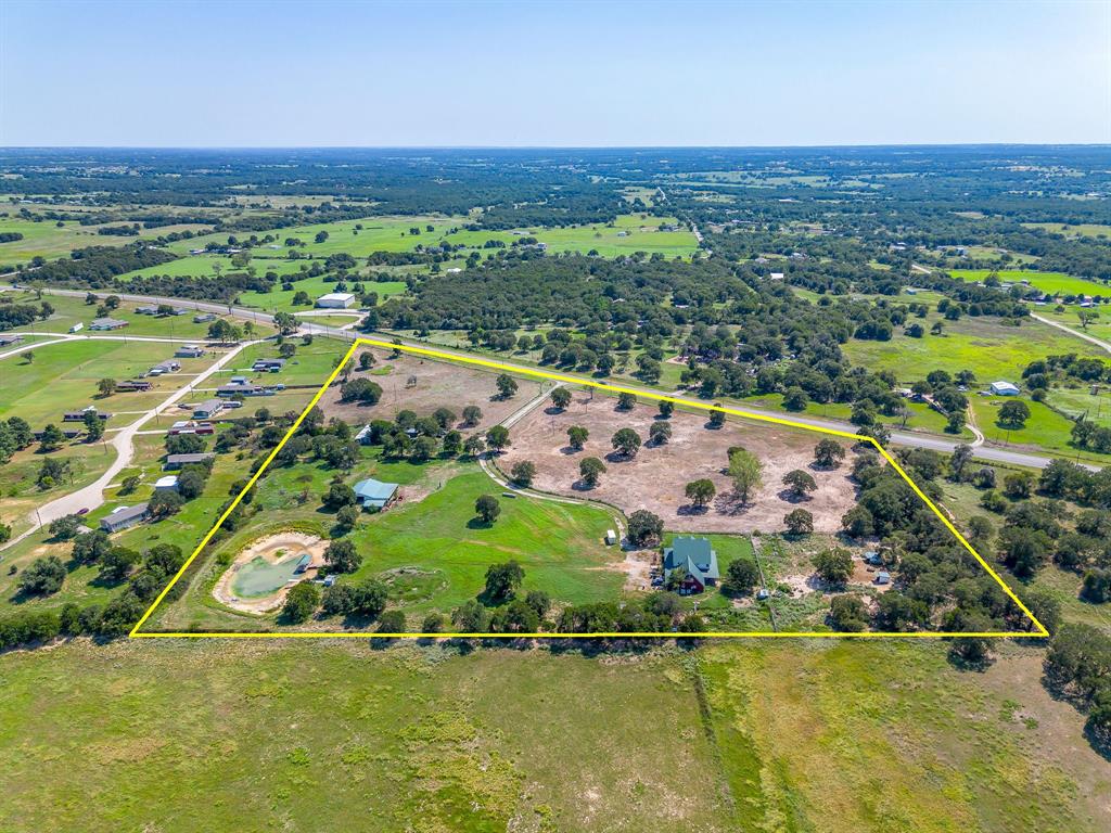 7726 West Highway 199 Springtown, TX 76082 - Photo 19 of 29 an aerial view of residential houses with outdoor space and swimming pool