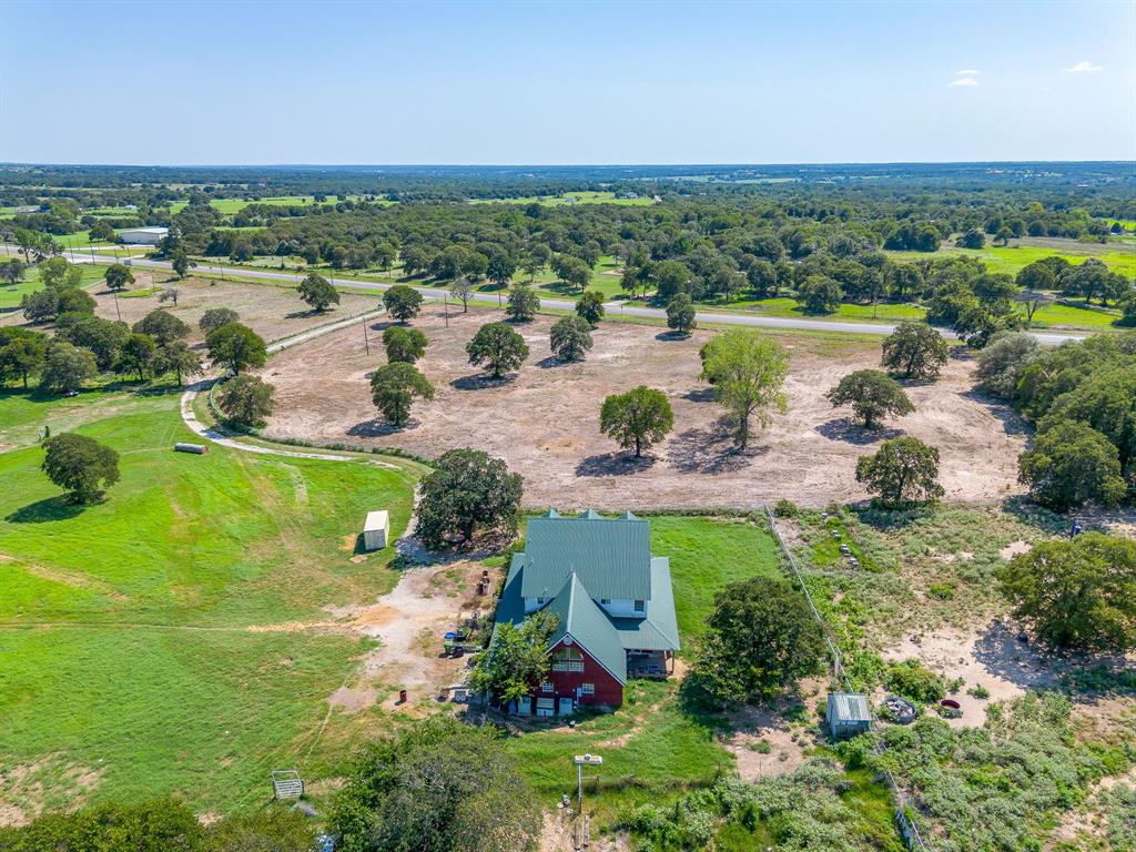 7726 West Highway 199 Springtown, TX 76082 - Photo 22 of 29 an aerial view of a houses with outdoor space and river