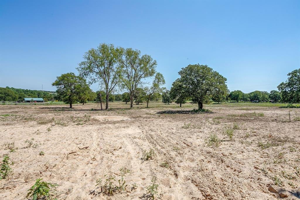 7726 West Highway 199 Springtown, TX 76082 - Photo 27 of 29 a view of dirt field with trees