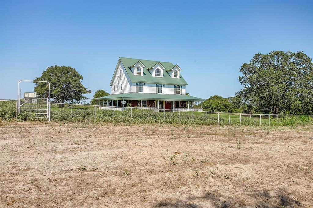 7726 West Highway 199 Springtown, TX 76082 - Photo 4 of 29 a front view of a house with garden