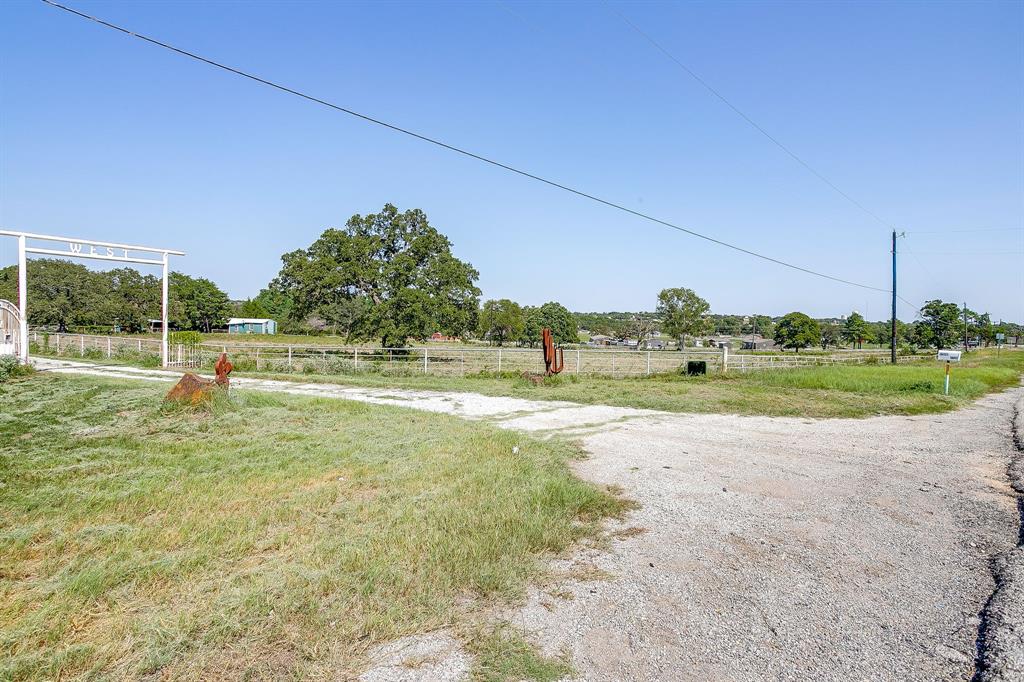7726 West Highway 199 Springtown, TX 76082 - Photo 8 of 29 a view of a big yard with potted plants