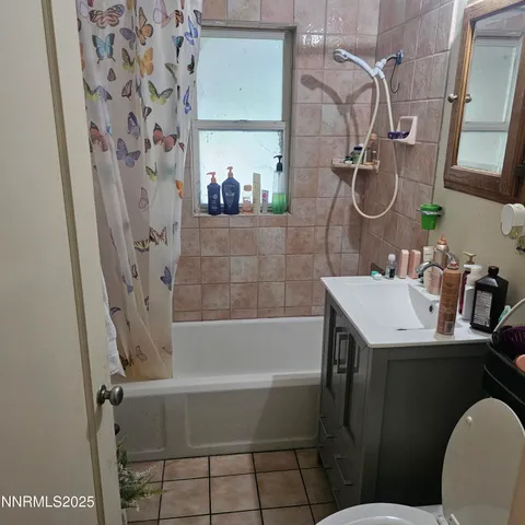 a living room with furniture and a lamp