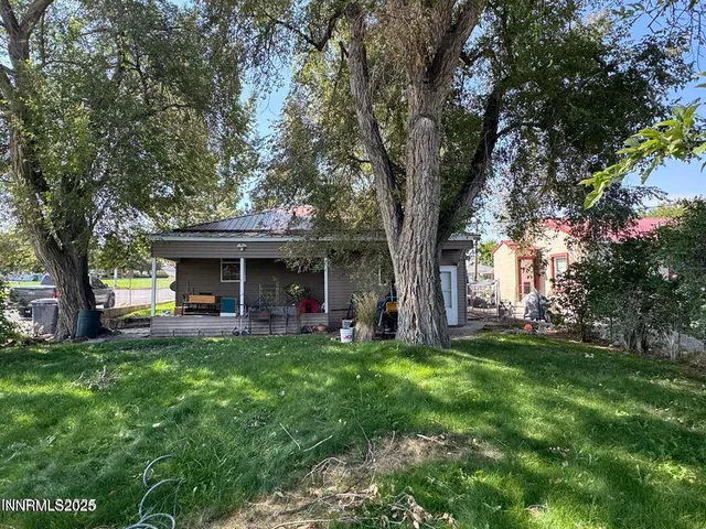 a view of a house with a big yard