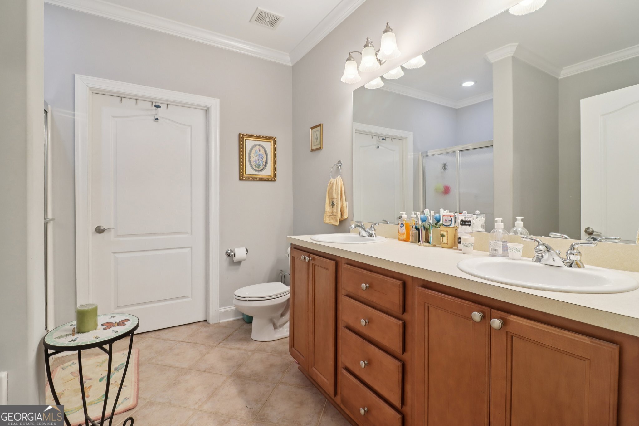 1502 Commonwealth Circle Newnan, GA 30263 - Photo 14 of 30 a spacious bathroom with a double vanity sink mirror and toilet