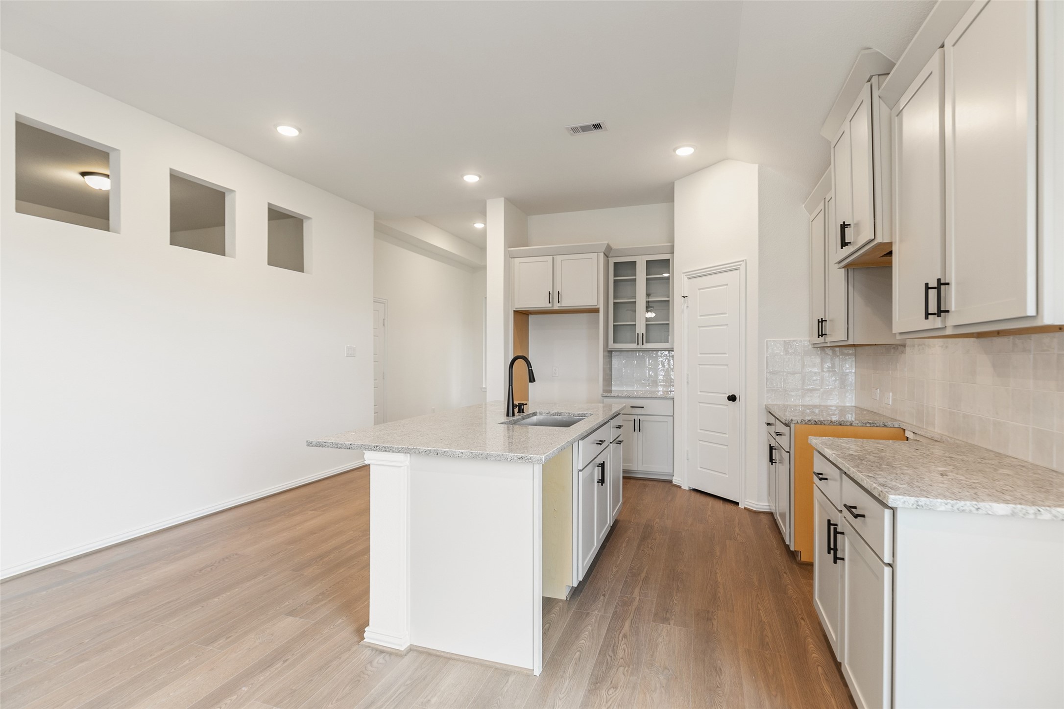 2801 Ruby Laurel Drive Iowa Colony, TX 77583 - Photo 12 of 31 a kitchen with stainless steel appliances granite countertop a sink stove and refrigerator