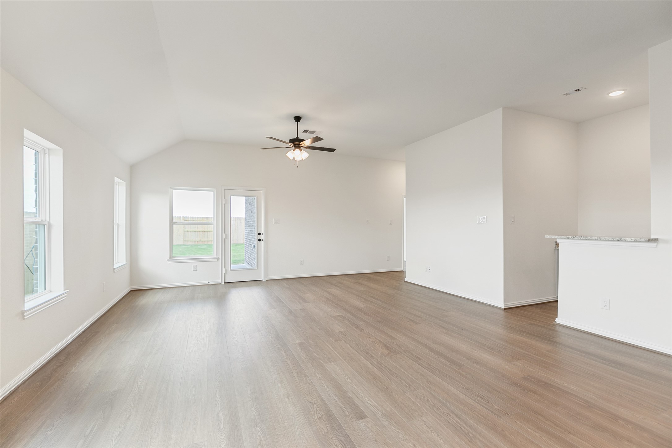 2801 Ruby Laurel Drive Iowa Colony, TX 77583 - Photo 14 of 31 wooden floor in an empty room with a window