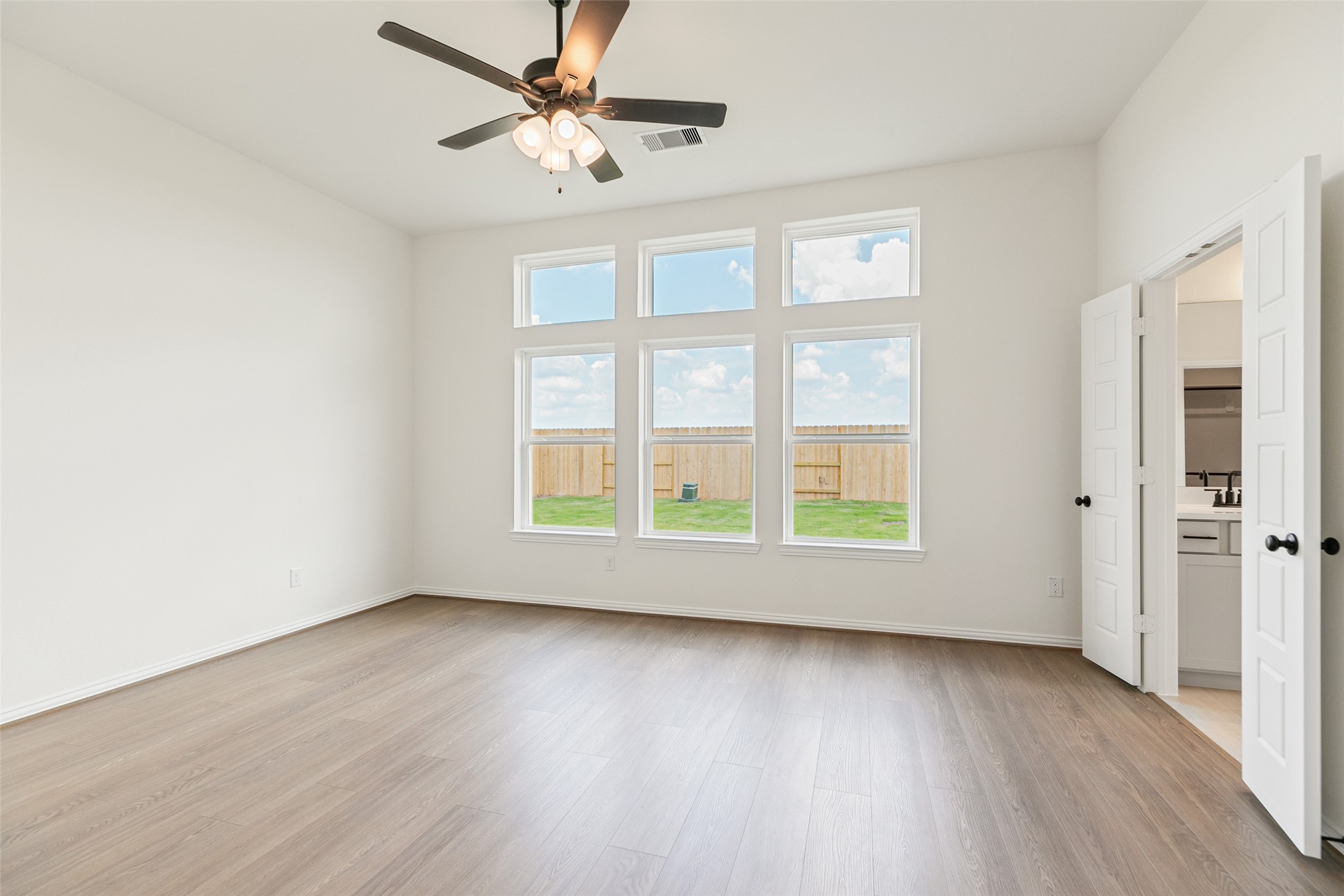 2801 Ruby Laurel Drive Iowa Colony, TX 77583 - Photo 24 of 31 a view of an empty room with wooden floor and a window