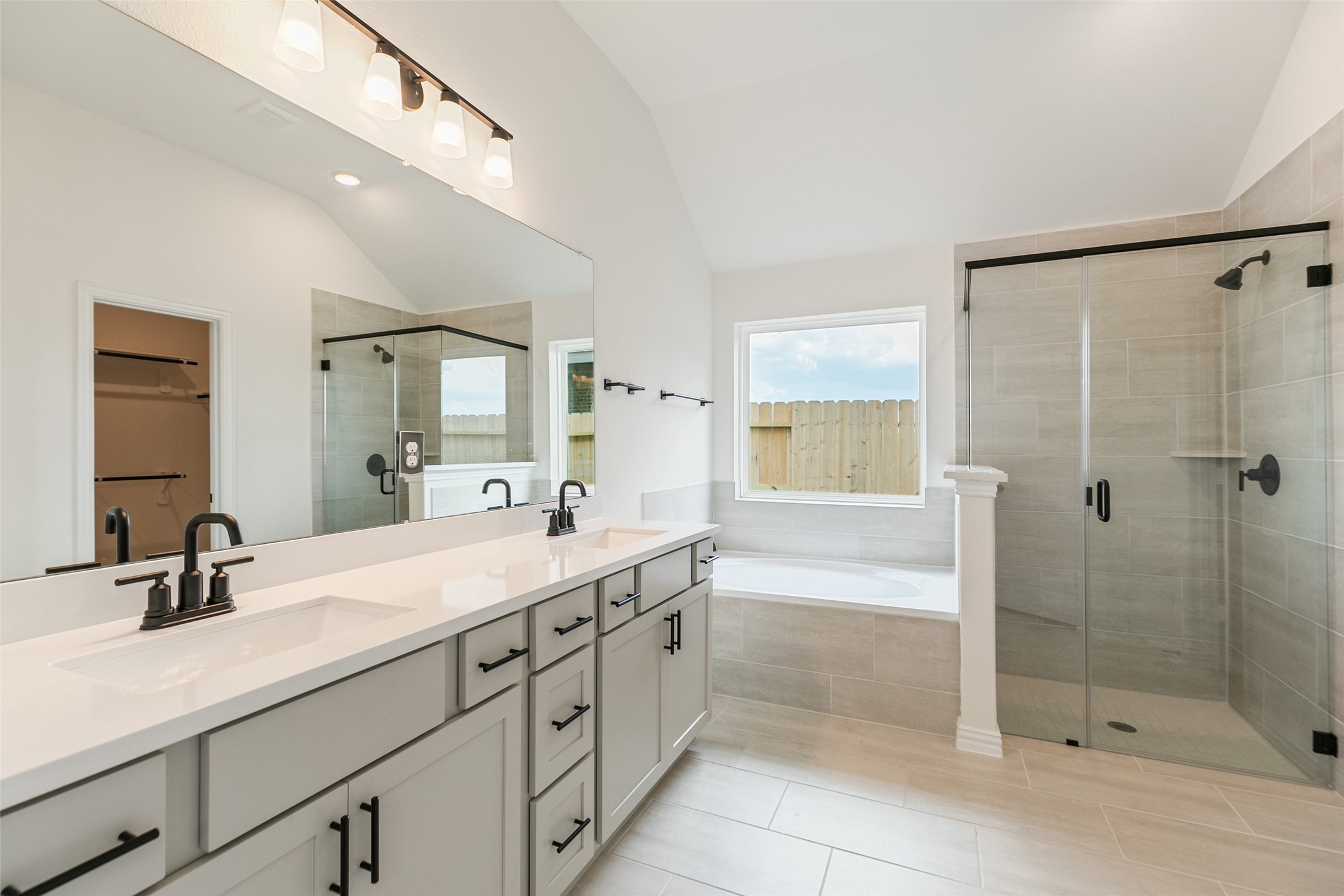2801 Ruby Laurel Drive Iowa Colony, TX 77583 - Photo 26 of 31 a spacious bathroom with a shower sink and mirror