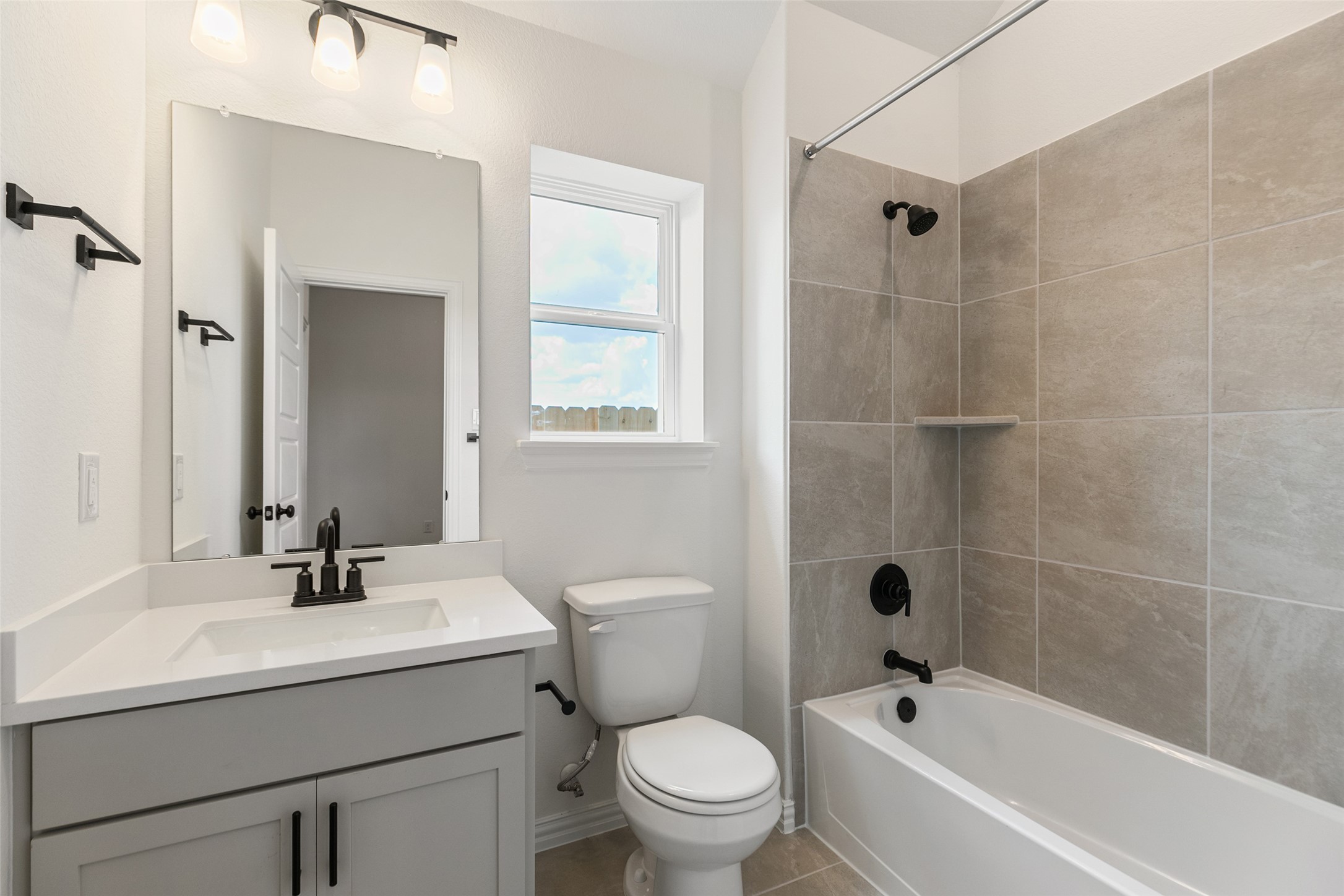 2801 Ruby Laurel Drive Iowa Colony, TX 77583 - Photo 7 of 31 a bathroom with a sink toilet and shower