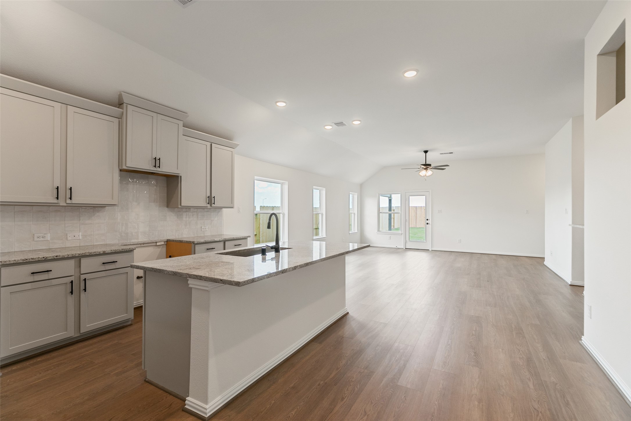 2801 Ruby Laurel Drive Iowa Colony, TX 77583 - Photo 8 of 31 a kitchen with cabinets wooden floor and a sink
