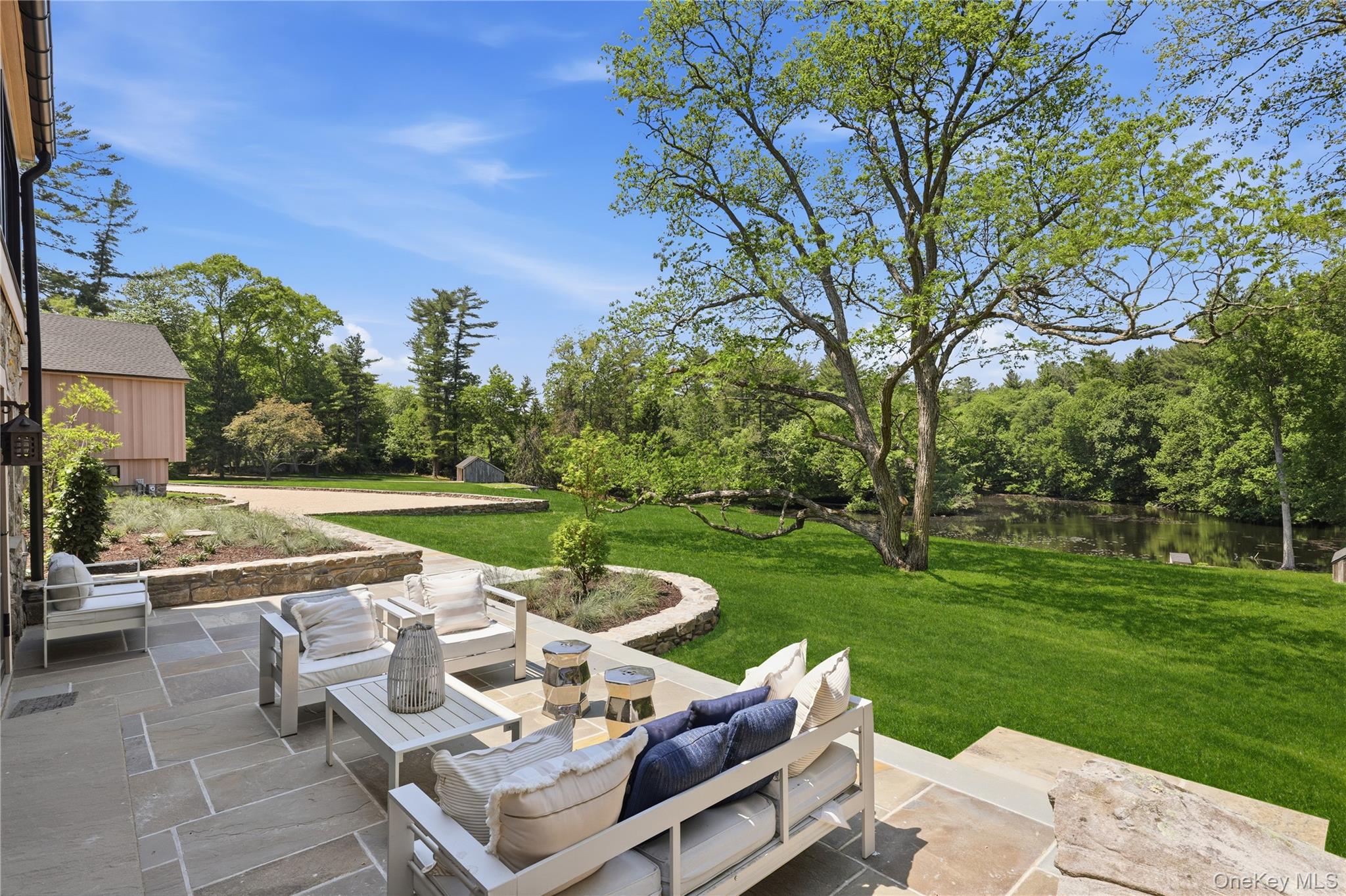 39 Old Snake Hill Road Pound Ridge, NY 10576 - Photo 4 of 37 a view of a patio with garden