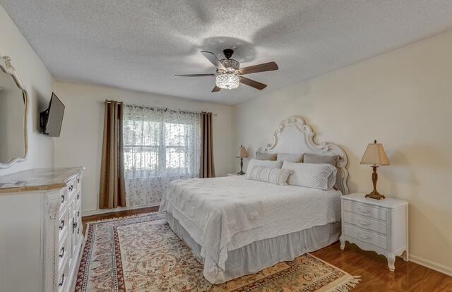 16914 Waterbend Drive, Unit 167 Jupiter, FL 33477 - Photo 18 of 46 a bedroom with a bed and a chandelier