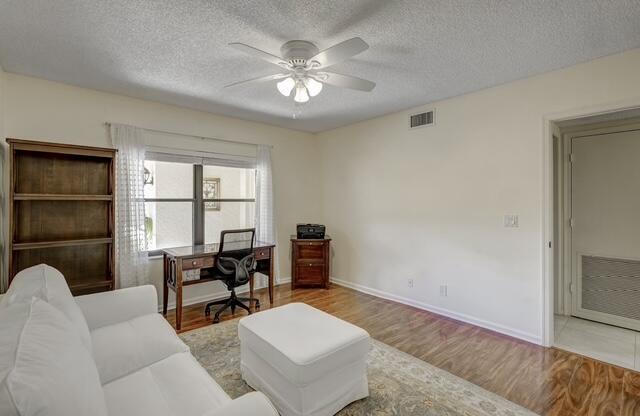 16914 Waterbend Drive, Unit 167 Jupiter, FL 33477 - Photo 24 of 46 a living room with furniture and a large window