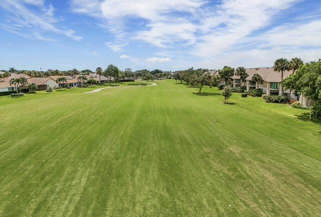 16914 Waterbend Drive, Unit 167 Jupiter, FL 33477 - Photo 36 of 46 a view of a lake with houses in the back