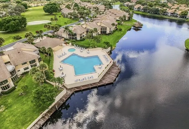 an aerial view of residential building and lake