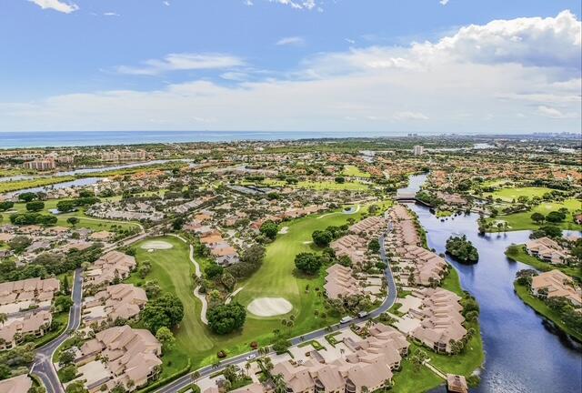 16914 Waterbend Drive, Unit 167 Jupiter, FL 33477 - Photo 40 of 46 an aerial view of residential building and lake