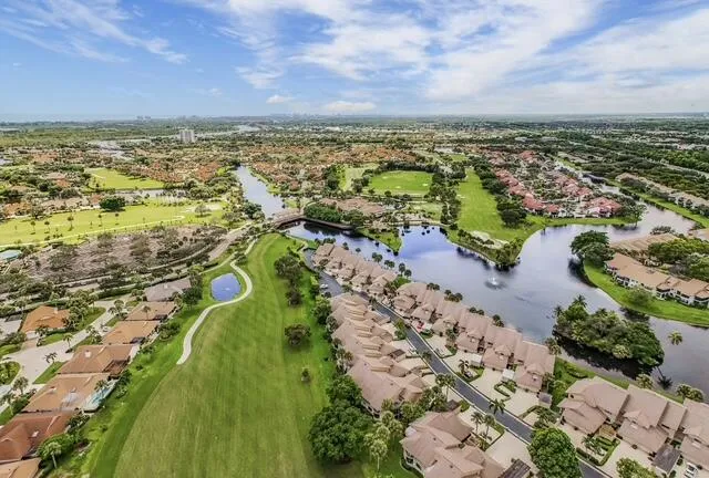 an aerial view of a residential houses with outdoor space