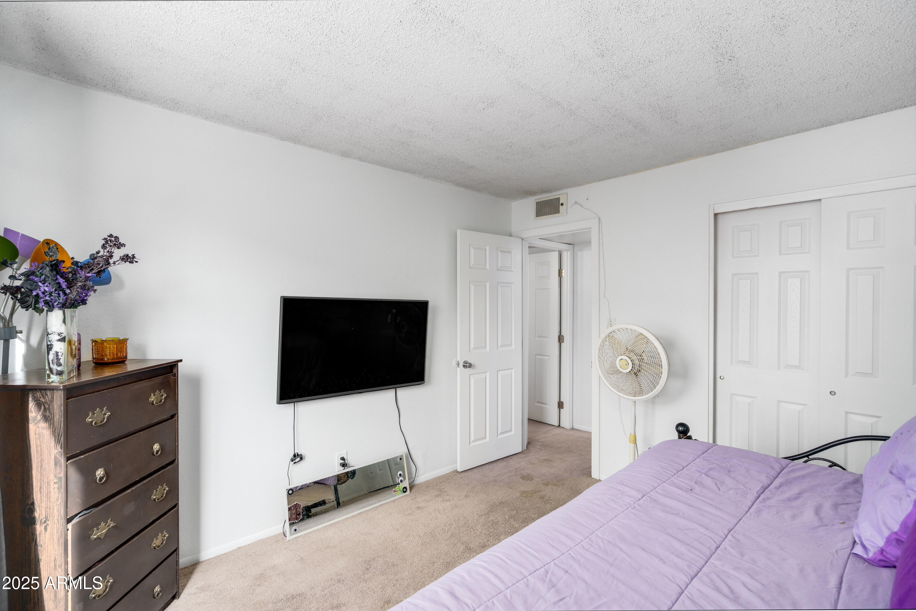 1032 East Redfield Road Tempe, AZ 85283 - Photo 11 of 15 a bedroom with a bed and flat screen tv