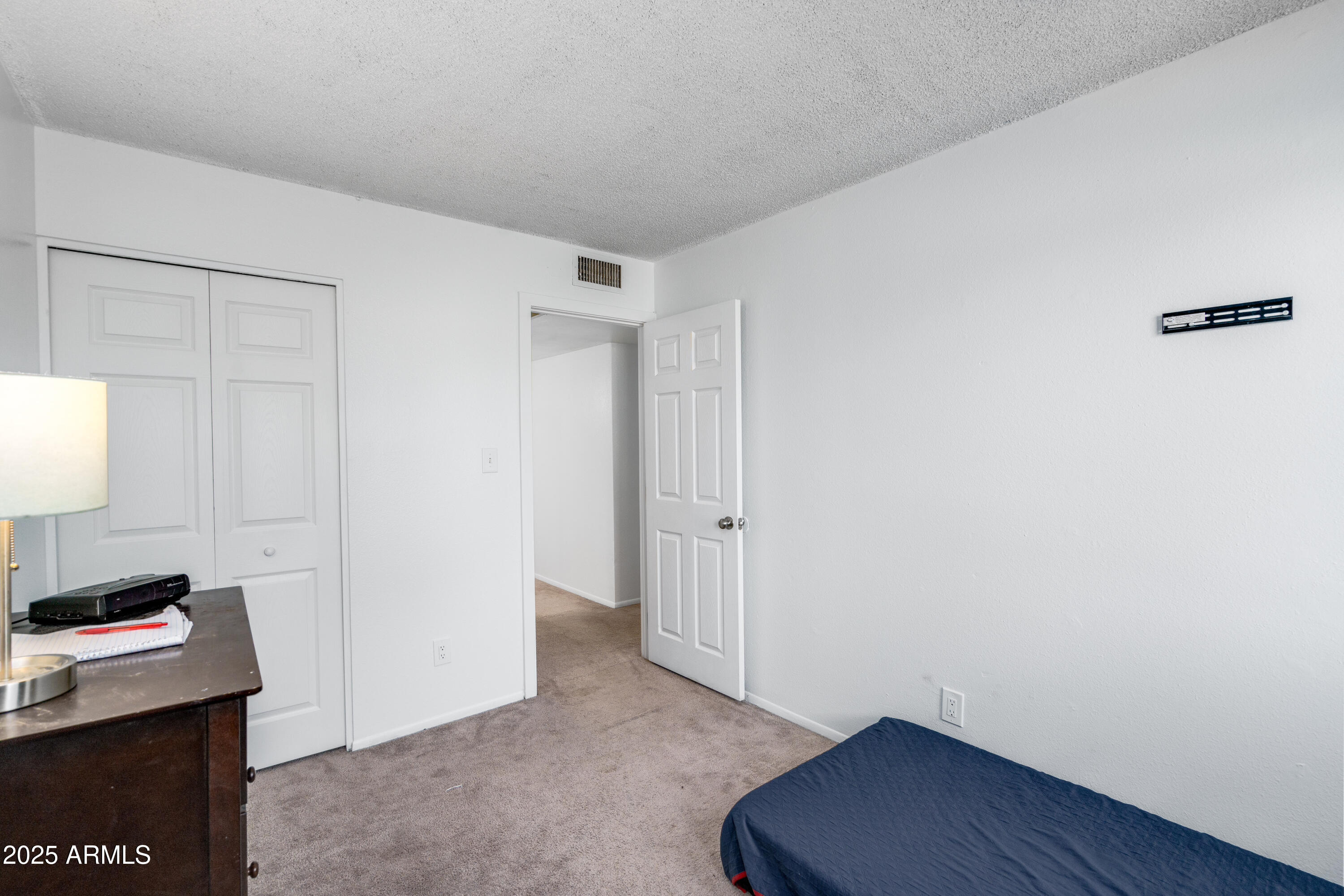 1032 East Redfield Road Tempe, AZ 85283 - Photo 12 of 15 a area with wooden floor and shoes