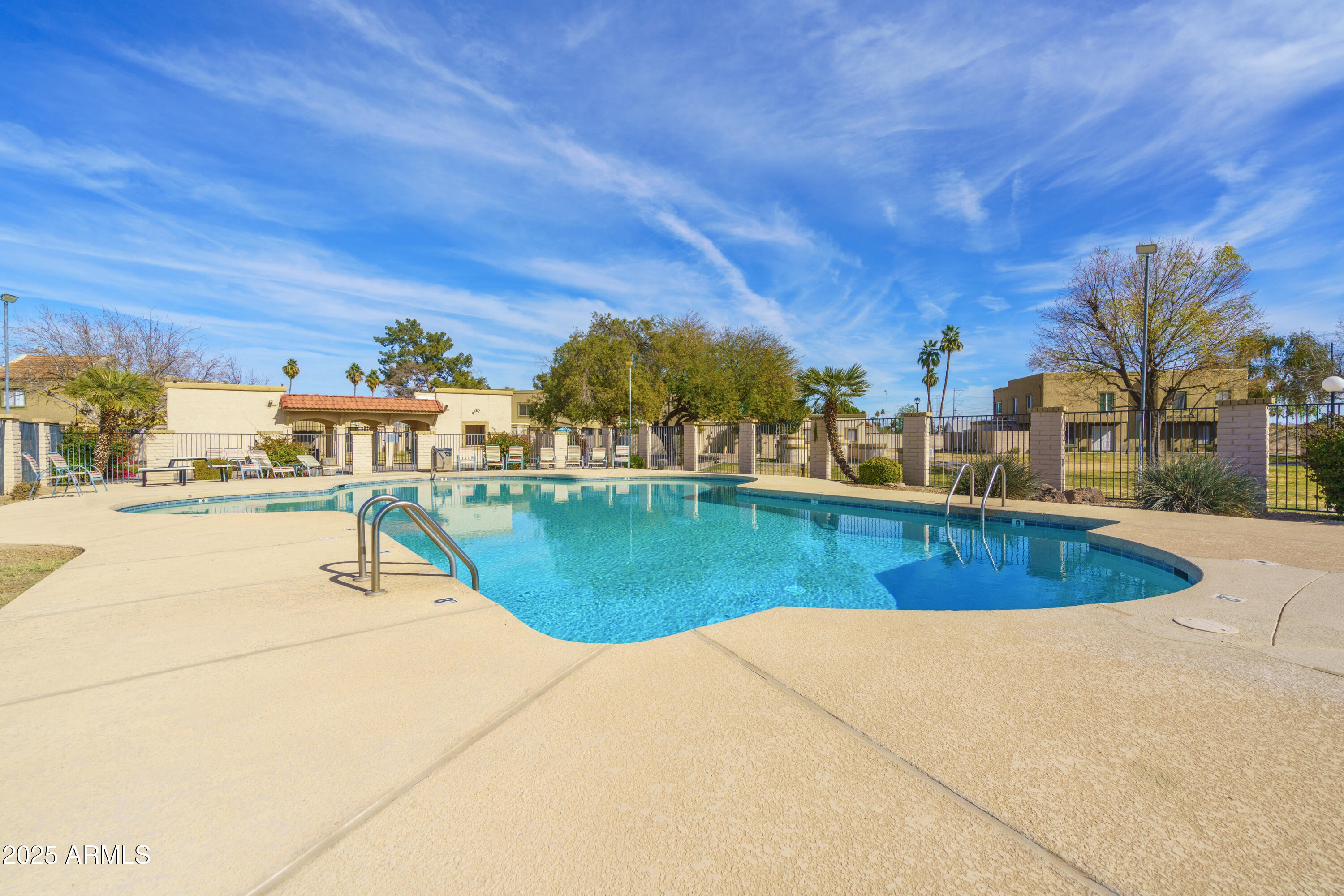 1032 East Redfield Road Tempe, AZ 85283 - Photo 15 of 15 a view of a swimming pool with a yard