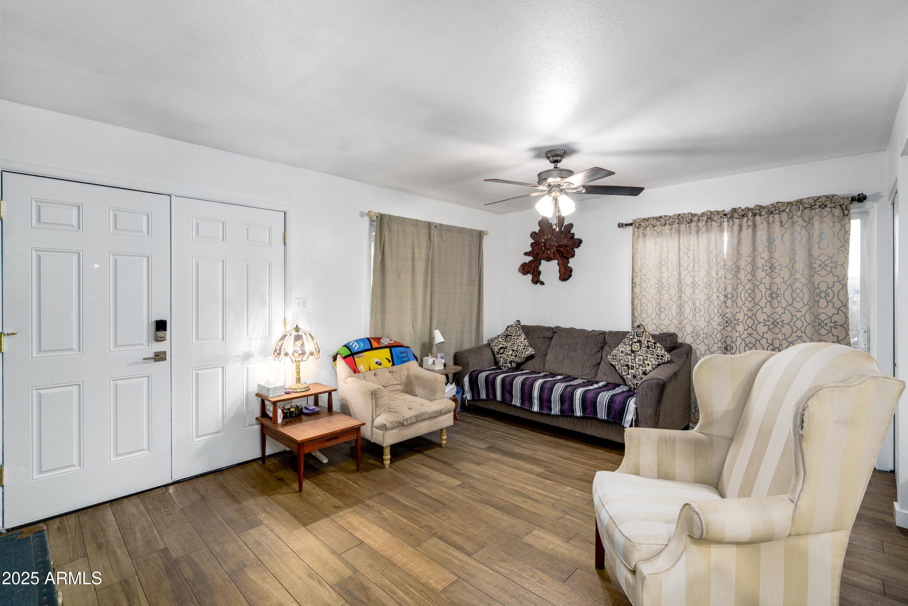 1032 East Redfield Road Tempe, AZ 85283 - Photo 4 of 15 a living room with furniture and wooden floor