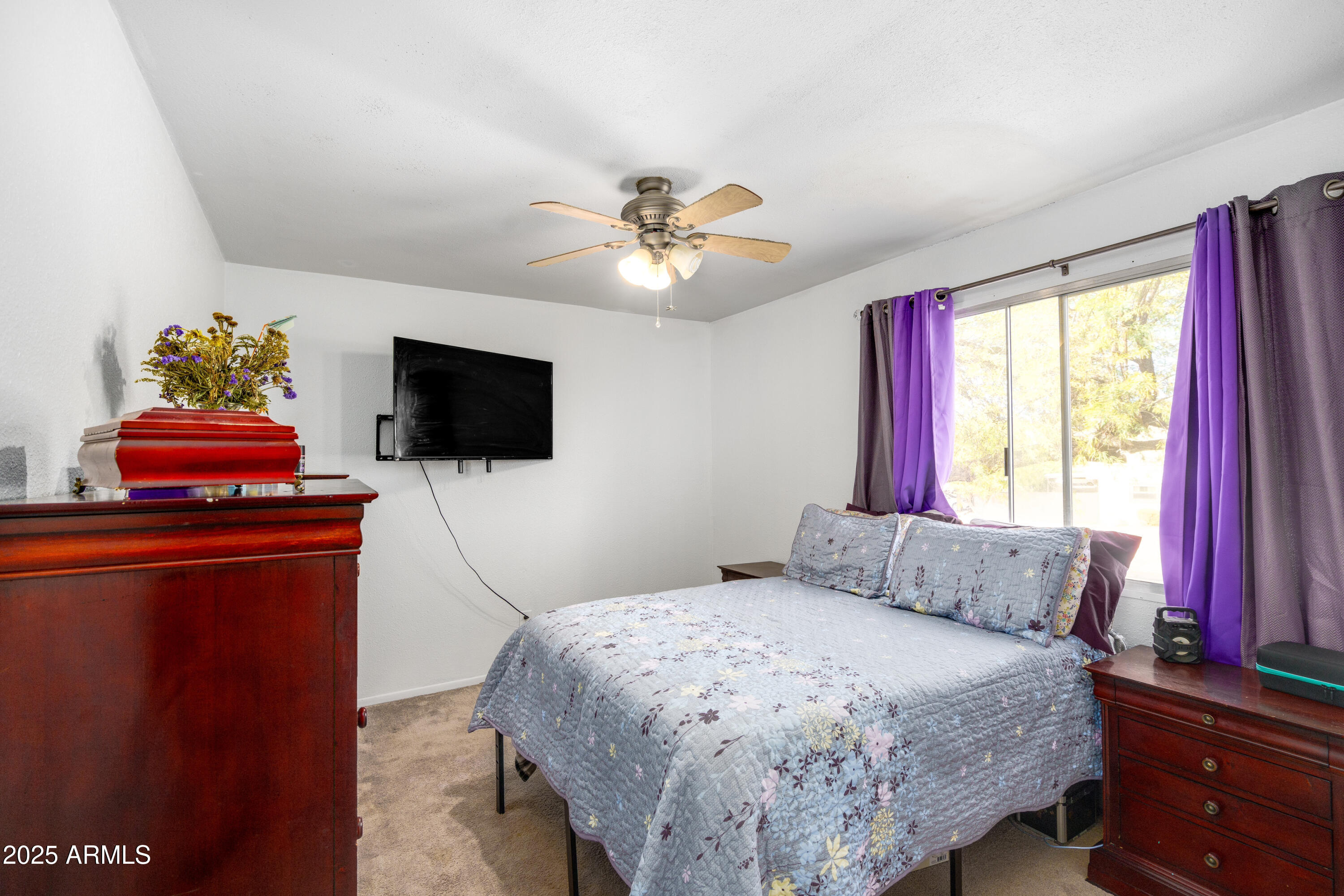1032 East Redfield Road Tempe, AZ 85283 - Photo 8 of 15 a bedroom with a bed and a flat screen tv