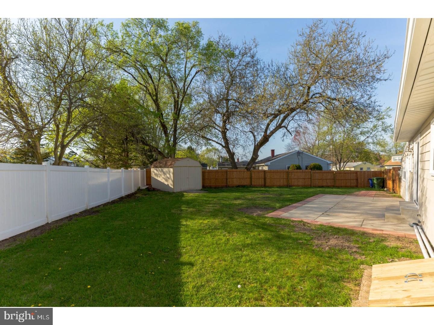 21 Boswell Road Marlton, NJ 08053 - Photo 22 of 24 a view of a yard with plants and a large tree