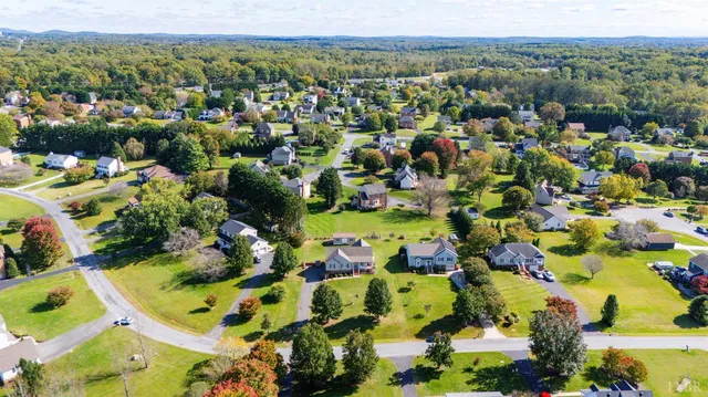 a living room with furniture fireplace and flat screen tv