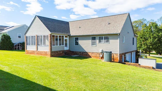 a front view of a house with yard and garage