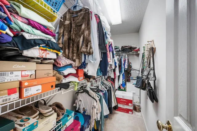 a bathroom with a granite countertop toilet sink and shower