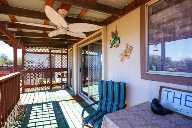 a view of a balcony with furniture