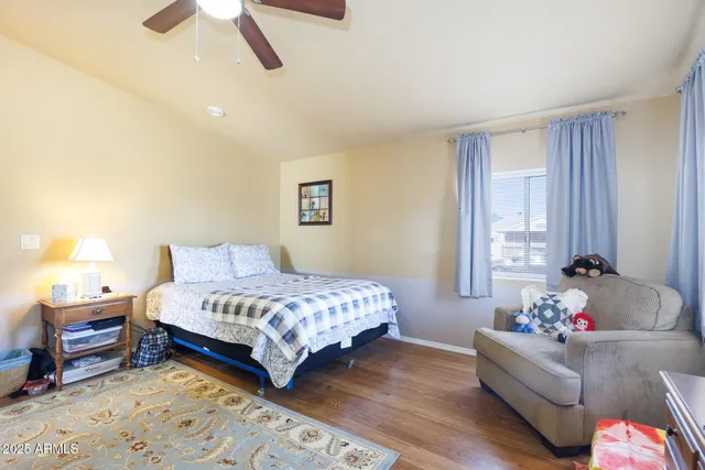 a bedroom with bed and window