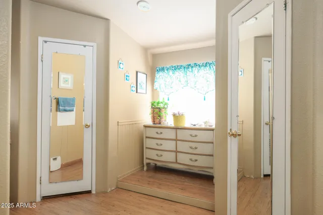 a en suite bathroom with a double vanity sink and a mirror
