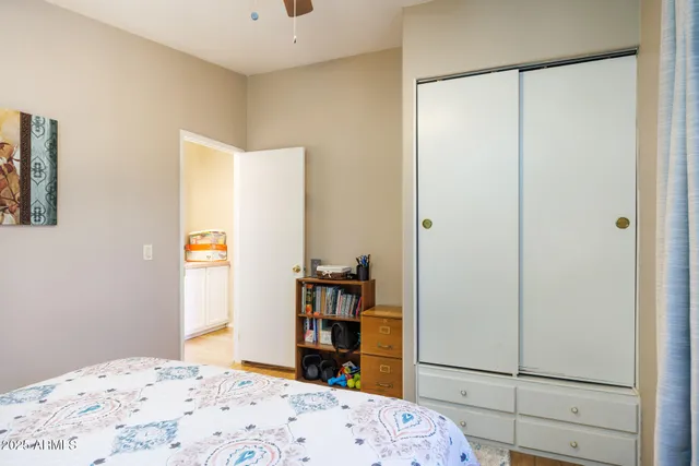 a bedroom with a bed and a closet