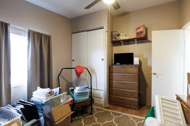 a bedroom with a bed and a closet