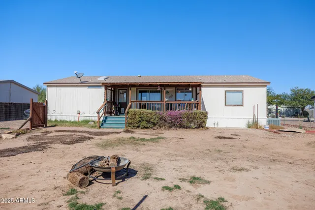 a view of a backyard with a patio