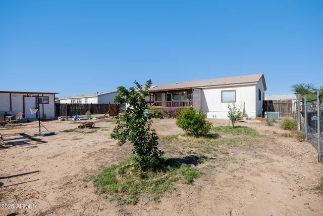 a view of a yard with cars