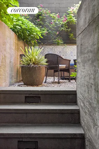 a view of a chairs and table in the patio