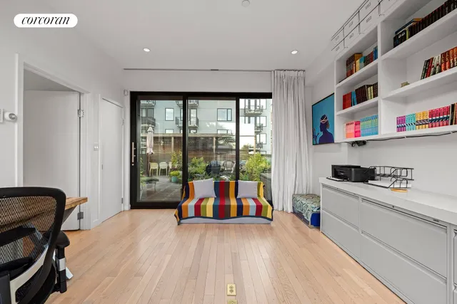 a view of a street with sitting area