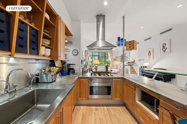 a view of a dining room with furniture wooden floor and a chandelier