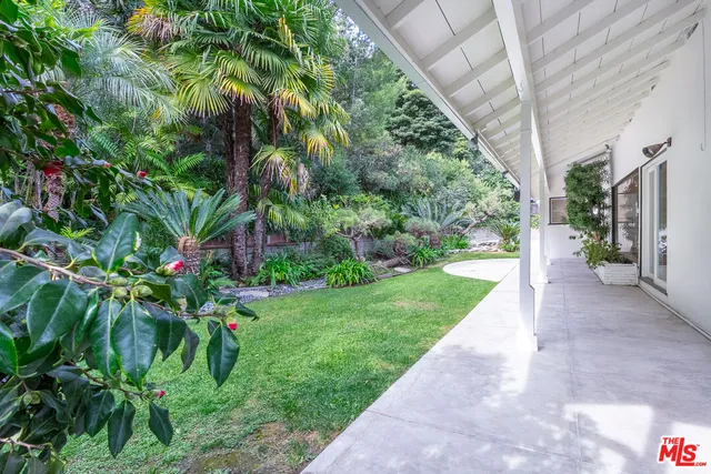 a backyard of a house with lots of green space