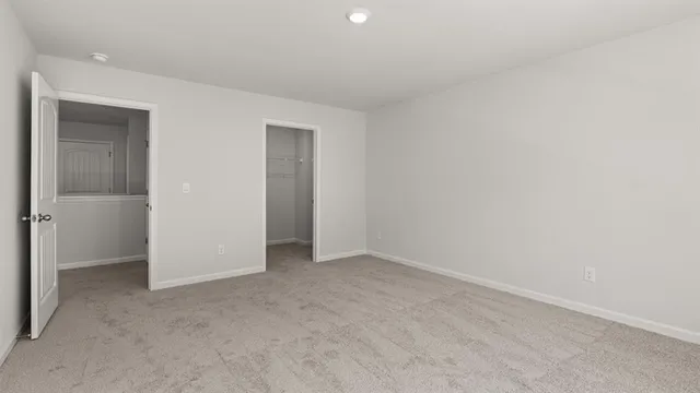 an empty room with closet area