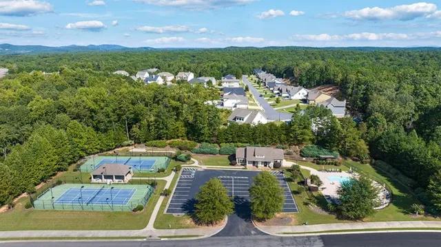 a aerial view of a house with swimming pool and garden