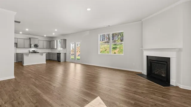 a view of kitchen with cabinets and wooden floor
