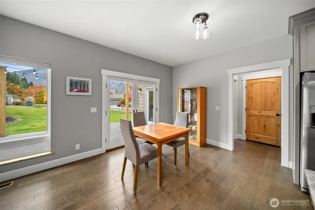 a kitchen with granite countertop kitchen island stainless steel appliances a sink stove and kitchen island