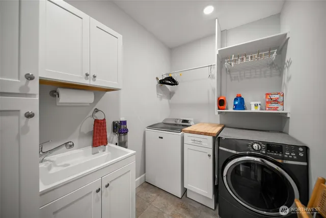 a spacious bathroom with a bathtub and shower